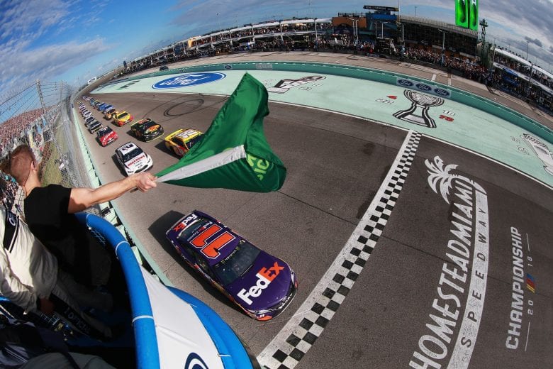 HOMESTEAD, FL - NOVEMBER 18:  Denny Hamlin, driver of the #11 FedEx Express Toyota, leads the field past the green flag to start the Monster Energy NASCAR Cup Series Ford EcoBoost 400 at Homestead-Miami Speedway on November 18, 2018 in Homestead, Florida.  (Photo by Sean Gardner/Getty Images) | Getty Images