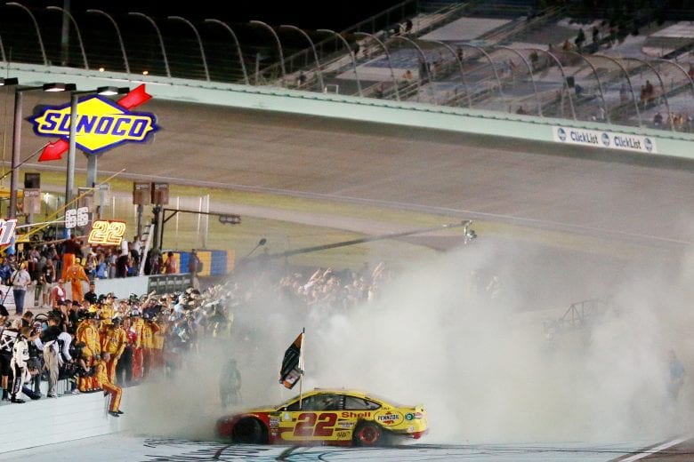 HOMESTEAD, FL - NOVEMBER 18:  Joey Logano, driver of the #22 Shell Pennzoil Ford, celebrates with a burnout after winning the Monster Energy NASCAR Cup Series Ford EcoBoost 400 and the Monster Energy NASCAR Cup Series Championship at Homestead-Miami Speedway on November 18, 2018 in Homestead, Florida.  (Photo by Sean Gardner/Getty Images) | Getty Images