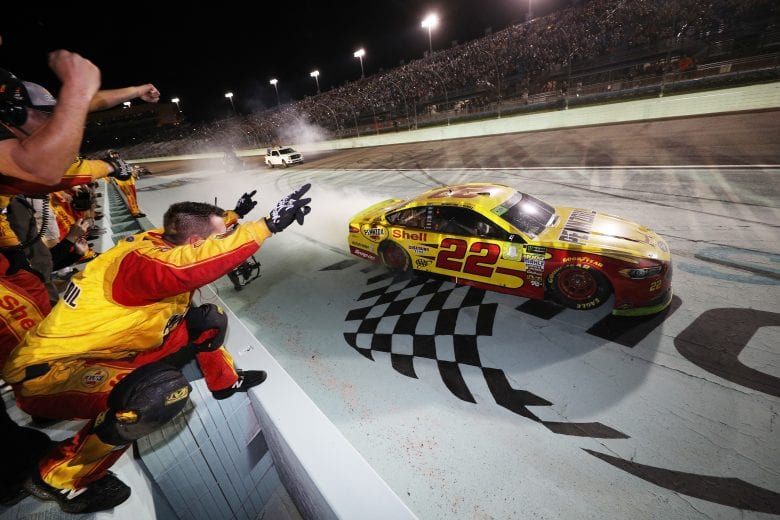 HOMESTEAD, FL - NOVEMBER 18:  Joey Logano, driver of the #22 Shell Pennzoil Ford, celebrates with teammates after winning the Monster Energy NASCAR Cup Series Ford EcoBoost 400 and the Monster Energy NASCAR Cup Series Championship at Homestead-Miami Speedway on November 18, 2018 in Homestead, Florida.  (Photo by Chris Graythen/Getty Images) | Getty Images