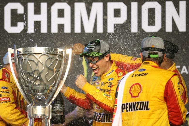 HOMESTEAD, FL - NOVEMBER 18:  Joey Logano, driver of the #22 Shell Pennzoil Ford, celebrates with crew members in Victory Lane after winning the Monster Energy NASCAR Cup Series Ford EcoBoost 400 at Homestead-Miami Speedway on November 18, 2018 in Homestead, Florida.  (Photo by Chris Graythen/Getty Images) | Getty Images