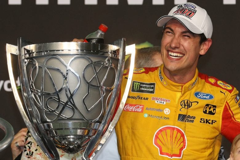 HOMESTEAD, FL - NOVEMBER 18:  Joey Logano, driver of the #22 Shell Pennzoil Ford, celebrates with the trophy after winning the Monster Energy NASCAR Cup Series Ford EcoBoost 400 at Homestead-Miami Speedway on November 18, 2018 in Homestead, Florida.  (Photo by Chris Graythen/Getty Images) | Getty Images