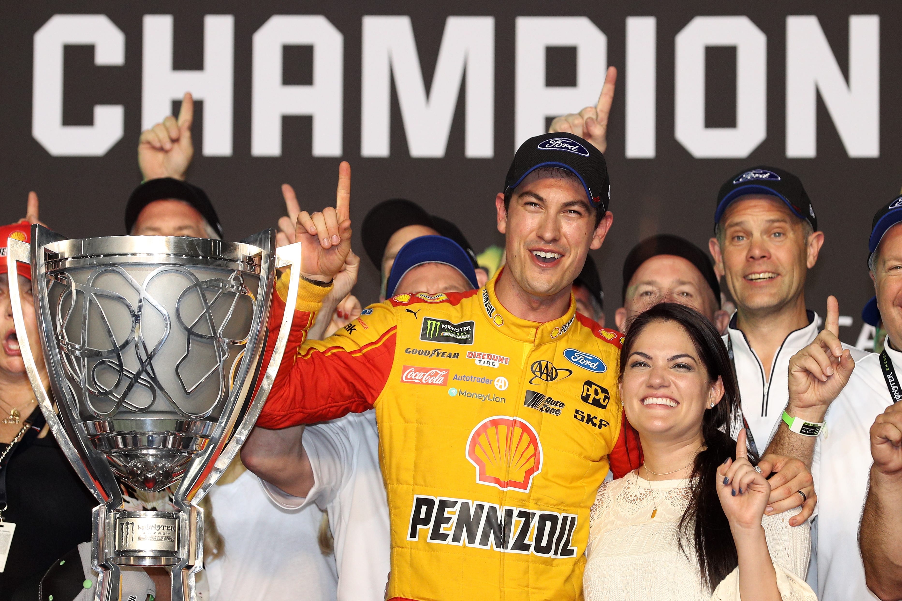 HOMESTEAD, FL - NOVEMBER 18:  Joey Logano, driver of the #22 Shell Pennzoil Ford, celebrates with his wife, Brittany, and son, Hudson, after winning the Monster Energy NASCAR Cup Series Ford EcoBoost 400 at Homestead-Miami Speedway on November 18, 2018 in Homestead, Florida.  (Photo by Chris Graythen/Getty Images) | Getty Images
