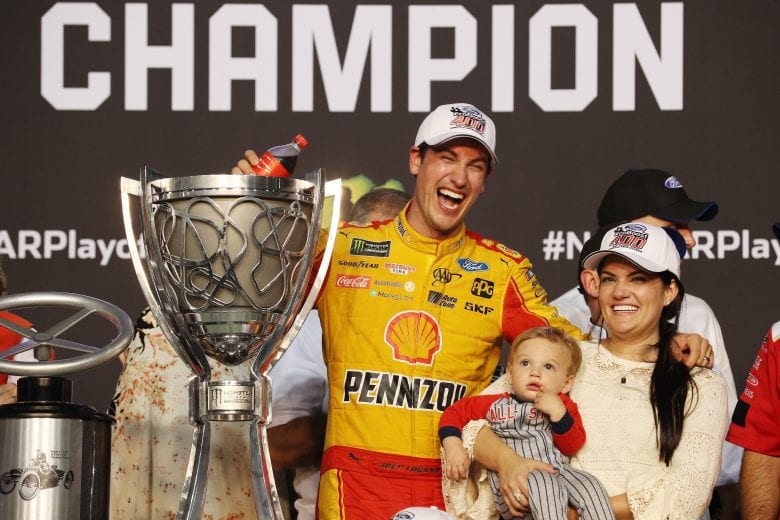 HOMESTEAD, FL - NOVEMBER 18:  Joey Logano, driver of the #22 Shell Pennzoil Ford, celebrates with his wife, Brittany, and son, Hudson, after winning the Monster Energy NASCAR Cup Series Ford EcoBoost 400 at Homestead-Miami Speedway on November 18, 2018 in Homestead, Florida.  (Photo by Chris Graythen/Getty Images) | Getty Images