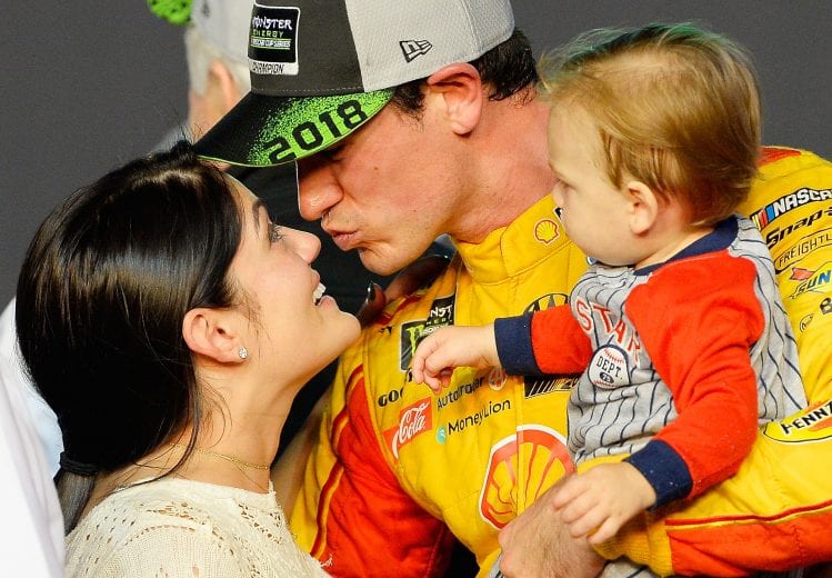 HOMESTEAD, FL - NOVEMBER 18:  Joey Logano, driver of the #22 Shell Pennzoil Ford, celebrates with his wife, Brittany, and son, Hudson, after winning the Monster Energy NASCAR Cup Series Ford EcoBoost 400 at Homestead-Miami Speedway on November 18, 2018 in Homestead, Florida.  (Photo by Robert Laberge/Getty Images) | Getty Images
