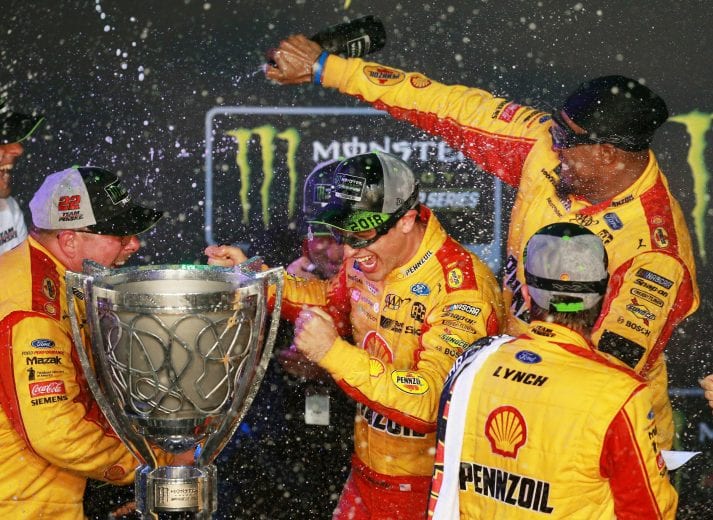 HOMESTEAD, FL - NOVEMBER 18:  Joey Logano, driver of the #22 Shell Pennzoil Ford, celebrates with champagne in Victory Lane after winning the Monster Energy NASCAR Cup Series Ford EcoBoost 400 at Homestead-Miami Speedway on November 18, 2018 in Homestead, Florida.  (Photo by Sean Gardner/Getty Images) | Getty Images