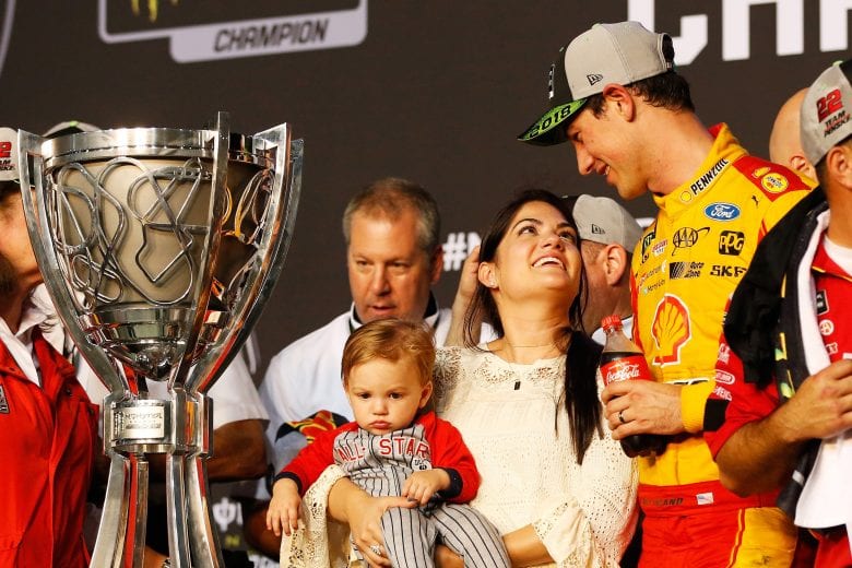 HOMESTEAD, FL - NOVEMBER 18:  Joey Logano, driver of the #22 Shell Pennzoil Ford, celebrates with his wife, Brittany, and son, Hudson, after winning the Monster Energy NASCAR Cup Series Ford EcoBoost 400 at Homestead-Miami Speedway on November 18, 2018 in Homestead, Florida.  (Photo by Chris Trotman/Getty Images) | Getty Images