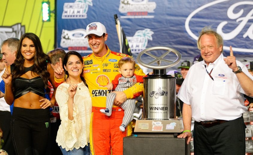 HOMESTEAD, FL - NOVEMBER 18:  Joey Logano, driver of the #22 Shell Pennzoil Ford, celebrates with his wife, Brittany, and son, Hudson, after winning the Monster Energy NASCAR Cup Series Ford EcoBoost 400 at Homestead-Miami Speedway on November 18, 2018 in Homestead, Florida.  (Photo by Robert Laberge/Getty Images) | Getty Images