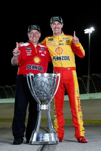 HOMESTEAD, FL - NOVEMBER 18:  Joey Logano, driver of the #22 Shell Pennzoil Ford, and crew chief Todd Gordon pose for a photo after winning the Monster Energy NASCAR Cup Series Ford EcoBoost 400 and the Monster Energy NASCAR Cup Series Championship at Homestead-Miami Speedway on November 18, 2018 in Homestead, Florida.  (Photo by Brian Lawdermilk/Getty Images) | Getty Images