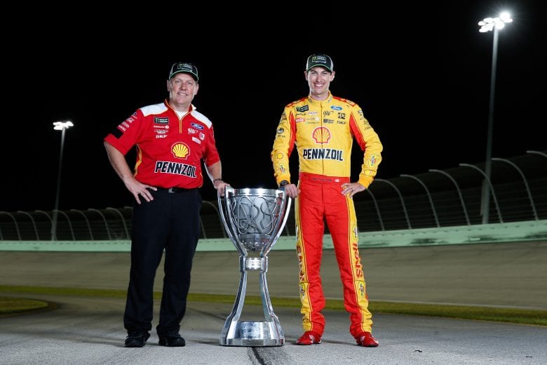 HOMESTEAD, FL - NOVEMBER 18:  Joey Logano, driver of the #22 Shell Pennzoil Ford, and crew chief Todd Gordon pose for a photo after winning the Monster Energy NASCAR Cup Series Ford EcoBoost 400 and the Monster Energy NASCAR Cup Series Championship at Homestead-Miami Speedway on November 18, 2018 in Homestead, Florida.  (Photo by Brian Lawdermilk/Getty Images) | Getty Images