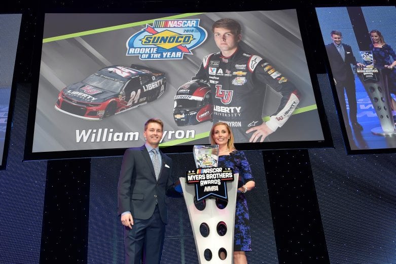 William Byron poses next to the Sunoco Rookie of the Year trophy at the NMPA Myers Brothers Awards ceremony.