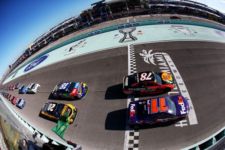 HOMESTEAD, FL - NOVEMBER 19:  Denny Hamlin, driver of the #11 FedEx Express Toyota, and Martin Truex Jr., driver of the #78 Bass Pro Shops/Tracker Boats Toyota, lead the field past the green flag to start the Monster Energy NASCAR Cup Series Championship Ford EcoBoost 400 at Homestead-Miami Speedway on November 19, 2017 in Homestead, Florida.  (Photo by Sarah Crabill/Getty Images) | Getty Images