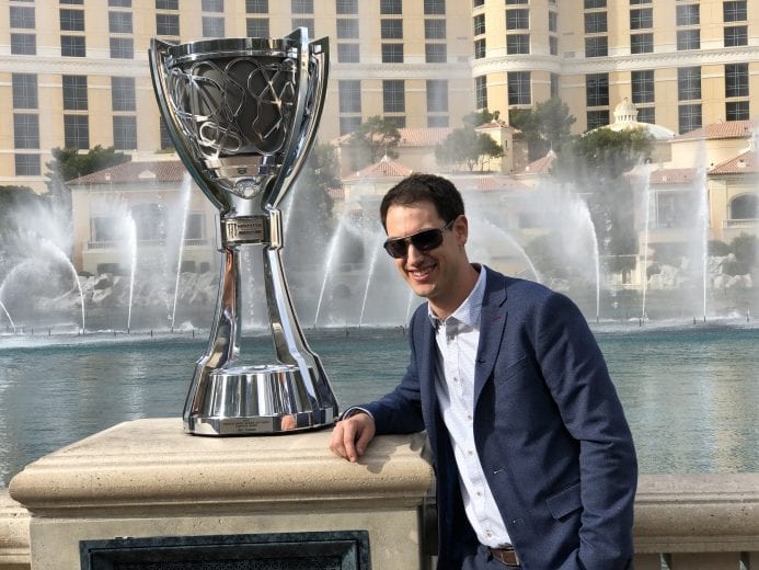 Joey Logano poses next to the Monster Energy Series championship trophy at the Bellagio in Las Vegas.