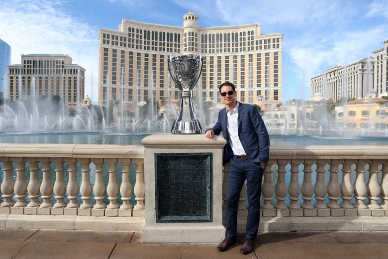 Joey Logano poses next to the Monster Energy Series championship trophy at the Bellagio in Las Vegas.