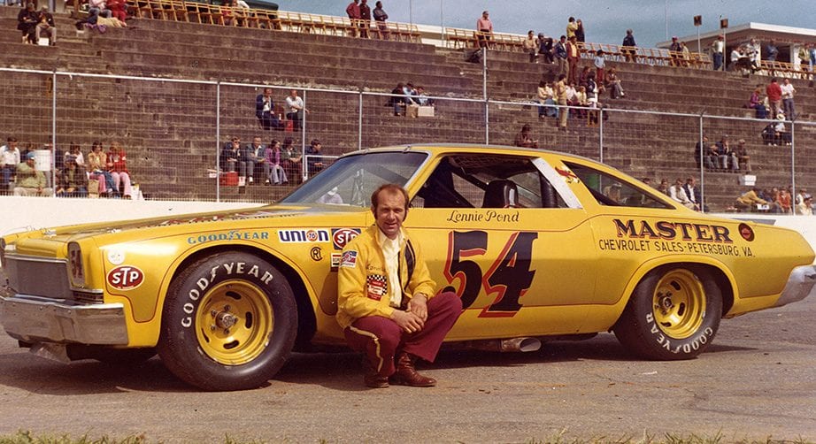 Lennie Pond poses next to the No. 54 car in the 1970s.