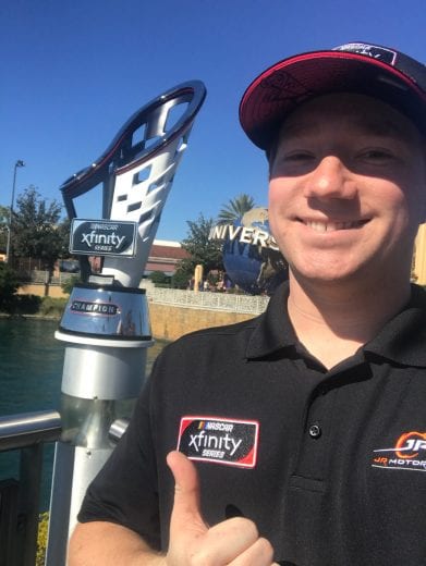 Tyler Reddick gives a thumbs up with the Xfinity Series championship trophy in Orlando.