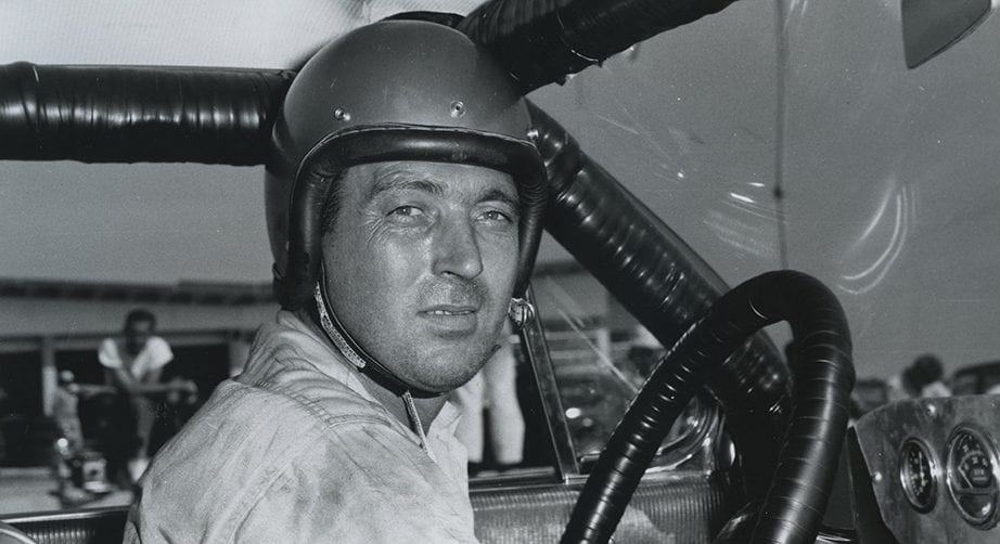 Woody Wilson sits in his car.