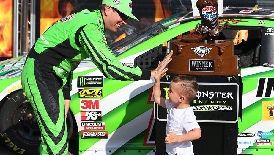 FORT WORTH, TX - APRIL 08: Kyle Busch, driver of the #18 Interstate Batteries Toyota, celebrates in Victory Lane with his son Brexton after winning the Monster Energy NASCAR Cup Series O'Reilly Auto Parts 500 at Texas Motor Speedway on April 8, 2018 in Fort Worth, Texas. (Photo by Richard Rodriguez/Getty Images) | Getty Images