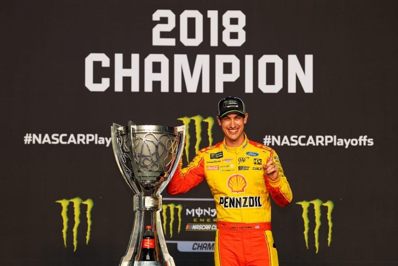 HOMESTEAD, FL - NOVEMBER 18: Joey Logano, driver of the #22 Shell Pennzoil Ford, celebrates with the trophy after winning the Monster Energy NASCAR Cup Series Ford EcoBoost 400 and the Monster Energy NASCAR Cup Series Championship at Homestead-Miami Speedway on November 18, 2018 in Homestead, Florida. (Photo by Robert Laberge/Getty Images) | Getty Images