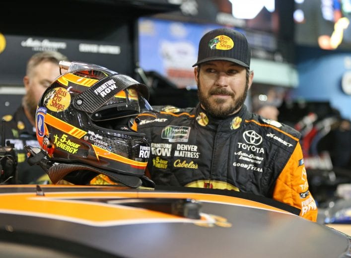 HOMESTEAD, FL - NOVEMBER 16: Martin Truex Jr., driver of the #78 Bass Pro Shops/5-hour ENERGY Toyota, gets into his car during qualifying for the Monster Energy NASCAR Cup Series Ford EcoBoost 400 at Homestead-Miami Speedway on November 16, 2018 in Homestead, Florida. (Photo by Matt Sullivan/Getty Images) | Getty Images