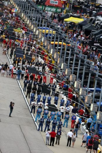 DARLINGTON, SC - SEPTEMBER 02:  Drivers and crew members stand at attention during the national anthem prior to the Monster Energy NASCAR Cup Series Bojangles' Southern 500 at Darlington Raceway on September 2, 2018 in Darlington, South Carolina.  (Photo by Brian Lawdermilk/Getty Images) | Getty Images