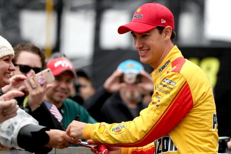 Joey Logano greets fans at Indianapolis Motor Speedway.