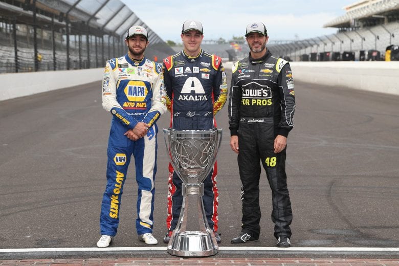 INDIANAPOLIS, IN - SEPTEMBER 10: Chase Elliott, driver of the #9 NAPA Auto Parts Chevrolet,, Alex Bowman, driver of the #88 Axalta Chevrolet, and Jimmie Johnson, driver of the #48 Lowe's for Pros Chevrolet, pose for a photo with the Monster Energy NASCAR Cup Series trophy after making the playoffs following the Monster Energy NASCAR Cup Series Big Machine Vodka 400 at the Brickyard at Indianapolis Motor Speedway on September 10, 2018 in Indianapolis, Indiana. (Photo by Brian Lawdermilk/Getty Images) | Getty Images