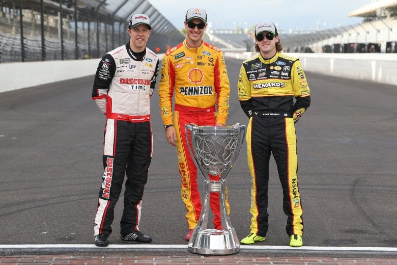 INDIANAPOLIS, IN - SEPTEMBER 10:  Brad Keselowski, driver of the #2 Discount Tire Ford, Joey Logano, driver of the #22 Shell Pennzoil Ford, Ryan Blaney, driver of the #12 BODYARMOR Ford, pose for a photo with the Monster Energy NASCAR Cup Series trophy after making the playoffs following the Monster Energy NASCAR Cup Series Big Machine Vodka 400 at the Brickyard at Indianapolis Motor Speedway on September 10, 2018 in Indianapolis, Indiana.  (Photo by Brian Lawdermilk/Getty Images) | Getty Images