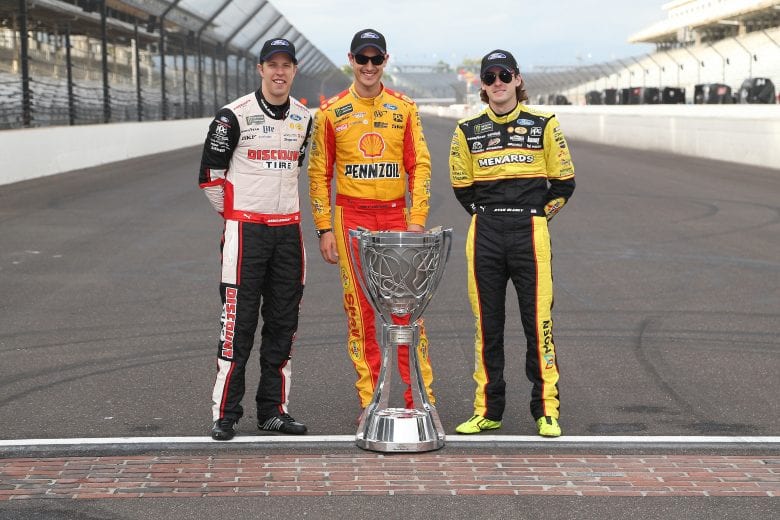 Team Penske drivers Brad Keselowski, Joey Logano and Ryan Blaney with the Monster Energy Series trophy at Indianapolis Motor Speedway.