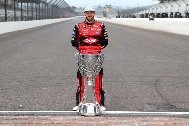 INDIANAPOLIS, IN - SEPTEMBER 10: Austin Dillon, driver of the #3 Dow MOLYKOTE Chevrolet, poses for a photo with the Monster Energy NASCAR Cup Series trophy after making the playoffs following the Monster Energy NASCAR Cup Series Big Machine Vodka 400 at the Brickyard at Indianapolis Motor Speedway on September 10, 2018 in Indianapolis, Indiana. (Photo by Brian Lawdermilk/Getty Images) | Getty Images