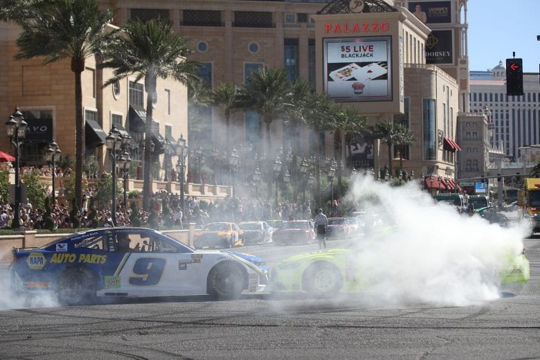 LAS VEGAS, NV - SEPTEMBER 13: Chase Elliott, driver of the #9 NAPA Auto Parts Chevrolet, and Ryan Blaney, driver of the #12 Menard's Fordduring the NASCAR Burnout Boulevard Fueled by Sunoco on September 13, 2018 in Las Vegas, Nevada. (Photo by Chris Graythen/Getty Images) | Getty Images