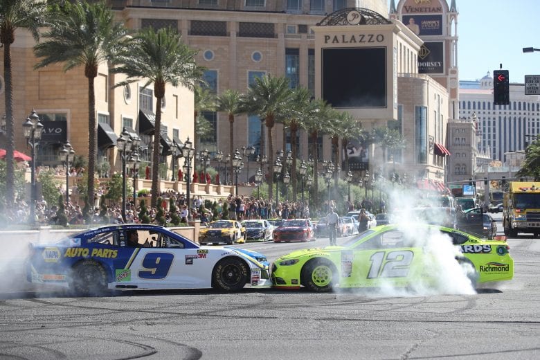 LAS VEGAS, NV - SEPTEMBER 13:  Chase Elliott, driver of the #9 NAPA Auto Parts Chevrolet, and Ryan Blaney, driver of the #12 Menard's Fordduring the NASCAR Burnout Boulevard Fueled by Sunoco on September 13, 2018 in Las Vegas, Nevada.  (Photo by Chris Graythen/Getty Images) | Getty Images