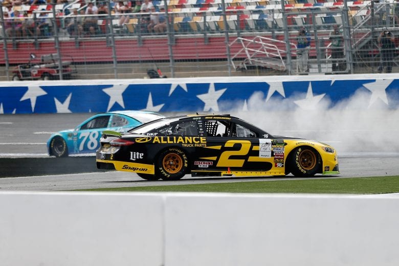 CHARLOTTE, NC - SEPTEMBER 30: Martin Truex Jr., driver of the #78 Auto-Owners Insurance Toyota, and Brad Keselowski, driver of the #2 Alliance Truck Parts Ford, spin during the Monster Energy NASCAR Cup Series Bank of America Roval 400 at Charlotte Motor Speedway on September 30, 2018 in Charlotte, North Carolina. (Photo by Brian Lawdermilk/Getty Images) | Getty Images