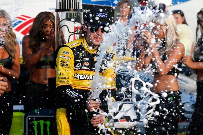CHARLOTTE, NC - SEPTEMBER 30:  Ryan Blaney, driver of the #12 Menards/Pennzoil Ford, celebrates in Victory Lane after winning the Monster Energy NASCAR Cup Series Bank of America Roval 400 at Charlotte Motor Speedway on September 30, 2018 in Charlotte, North Carolina.  (Photo by Brian Lawdermilk/Getty Images) | Getty Images