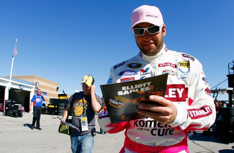 KANSAS CITY, KS - OCTOBER 01: Elliott Sadler, driver of the #19 Stanley Ford, signs autographs during practice for the NASCAR Sprint Cup Series Price Chopper 400 on October 1, 2010 in Kansas City, Kansas. (Photo by Jason Smith/Getty Images for NASCAR) | Getty Images