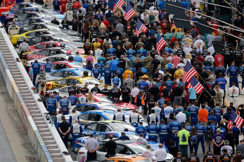 DOVER, DE - OCTOBER 07:  Teams are seen lined up on pit road during The National Anthem prior to the Monster Energy NASCAR Cup Series Gander Outdoors 400 at Dover International Speedway on October 7, 2018 in Dover, Delaware.  (Photo by Jonathan Ferrey/Getty Images) | Getty Images