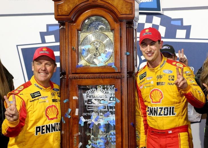 Joey Logano and crew chief Todd Gordon celebrated their Martinsville Speedway victory alongside the grandfather clock trophy.