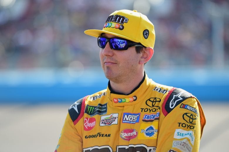 PHOENIX, AZ - NOVEMBER 11: Kyle Busch, driver of the #18 M&M's Toyota, stands on the grid prior to the Monster Energy NASCAR Cup Series Can-Am 500 at ISM Raceway on November 11, 2018 in Phoenix, Arizona. (Photo by Jared C. Tilton/Getty Images) | Getty Images