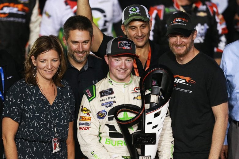HOMESTEAD, FL - NOVEMBER 17:  Tyler Reddick, driver of the #9 BurgerFi Chevrolet, Kelley Earnhardt Miller and Dale Earnhardt Jr. pose with the trophy in Victory Lane after winning the NASCAR Xfinity Series Ford EcoBoost 300 at Homestead-Miami Speedway on November 17, 2018 in Homestead, Florida.  (Photo by Sean Gardner/Getty Images) | Getty Images