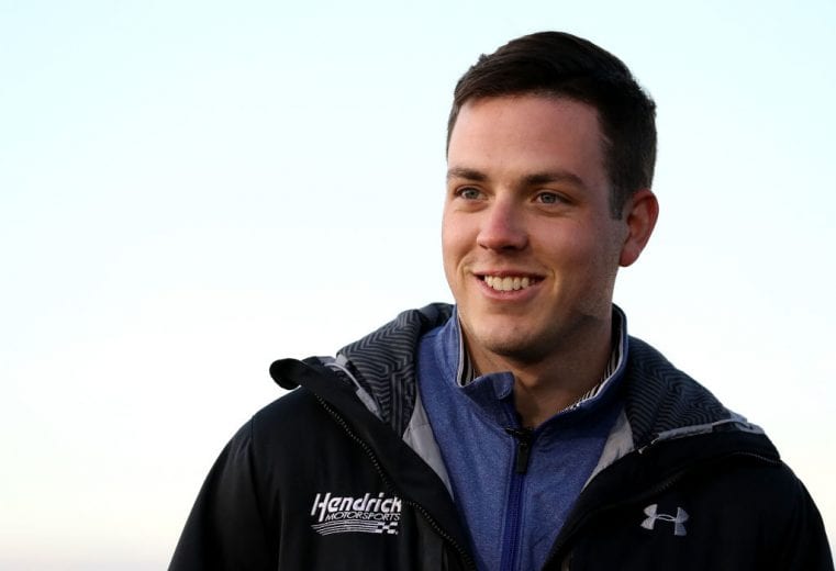 MOORESVILLE, NC - DECEMBER 06: Alex Bowman watches on during the Nationwide 2019 Paint Scheme Reveal at GoPro Motorplex on December 6, 2018 in Mooresville, North Carolina. (Photo by Streeter Lecka/Getty Images) | Getty Images