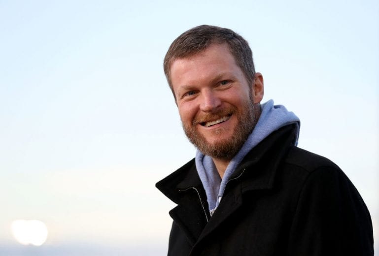 MOORESVILLE, NC - DECEMBER 06: Dale Earnhardt Jr. watches on during the Nationwide 2019 Paint Scheme Reveal at GoPro Motorplex on December 6, 2018 in Mooresville, North Carolina. (Photo by Streeter Lecka/Getty Images) | Getty Images