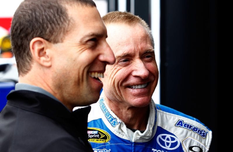 LONG POND, PA - JUNE 08: Mark Martin, driver of the #55 Aaron's Dream Machine Toyota, talks to team owner Rob Kauffman in the garage area during practice for the NASCAR Sprint Cup Series Party in the Poconos 400 at Pocono Raceway on June 8, 2013 in Long Pond, Pennsylvania. (Photo by Jeff Zelevansky/Getty Images) | Getty Images