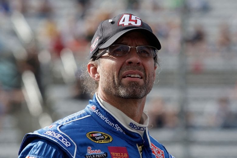 MARTINSVILLE, VA - MARCH 28: Kyle Petty, driver of the #45 Marathon AMerican Spirit Motor Oil Dodge, stands on the grid during qualifying for the NASCAR Sprint Cup Series Goody's Cool Orange 500 at Martinsville Speedway on March 28, 2008 in Martinsville, Virginia. (Photo by John Harrelson/Getty Images for NASCAR) | Getty Images