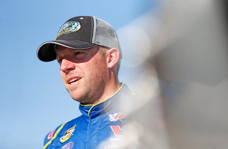 FORT WORTH, TX - NOVEMBER 02: Regan Smith, driver of the #92 BTS Tire & Wheel/Advance Auto Parts Ford, stands by his car during practice for the NASCAR Camping World Truck Series JAG Metals 350 Driving Hurricane Harvey Relief at Texas Motor Speedway on November 2, 2017 in Fort Worth, Texas. (Photo by Brian Lawdermilk/Getty Images) | Getty Images
