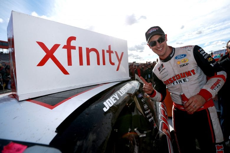Joey Logano with the winner's decal after an Xfinity Series triumph at Auto Club Speedway.