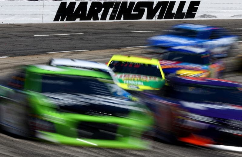 MARTINSVILLE, VA - MARCH 26:  Cars race during the weather delayed Monster Energy NASCAR Cup Series STP 500 at Martinsville Speedway on March 26, 2018 in Martinsville, Virginia.  (Photo by Sarah Crabill/Getty Images) | Getty Images