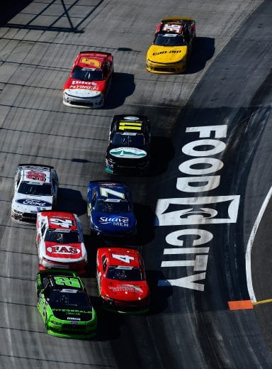 BRISTOL, TN - APRIL 14: Austin Cindric, driver of the #22 Fitzgerald Glider Kits Ford,  leads a pack of cars during the NASCAR Xfinity Series Fitzgerald Glider Kits 300 at Bristol Motor Speedway on April 14, 2018 in Bristol, Tennessee.  (Photo by Robert Laberge/Getty Images) | Getty Images