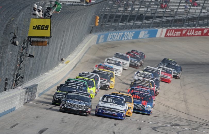 DOVER, DE - MAY 04:  Noah Gragson, driver of the #18 Safelite Toyota, and Johnny Sauter, driver of the #21 Allegiant Airlines Chevrolet, take the green flag to start the NASCAR Camping World Truck Series JEGS 200 at Dover International Speedway on May 4, 2018 in Dover, Delaware.  (Photo by Matt Sullivan/Getty Images) | Getty Images