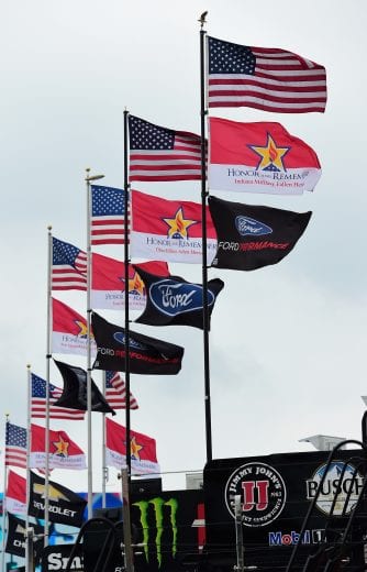 CHARLOTTE, NC - MAY 24:  A general view of the team haulers and their flags in the garage area during practice for the Monster Energy NASCAR Cup Series Coca-Cola 600 at Charlotte Motor Speedway on May 24, 2018 in Charlotte, North Carolina.  (Photo by Jared C. Tilton/Getty Images) | Getty Images