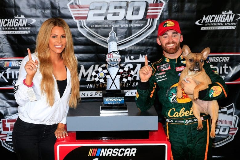 BROOKLYN, MI - JUNE 09: Austin Dillon, driver of the #3 Bass Pro Shops/Cabela's Chevrolet, poses in Victory Lane with his wife, Whitney, after winning the NASCAR Xfinity Series LTi Printing 250 at Michigan International Speedway on June 9, 2018 in Brooklyn, Michigan. (Photo by Daniel Shirey/Getty Images) | Getty Images