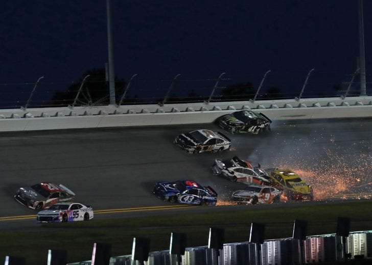 Denny Hamlin (11), Joey Logano (22), and Chase Elliott (9) are involved in an on-track incident at Daytona International Speedway.
